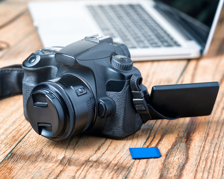 Camera on wood table backgroundの写真素材