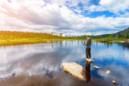 A man fly-fishing in Norwayの写真素材