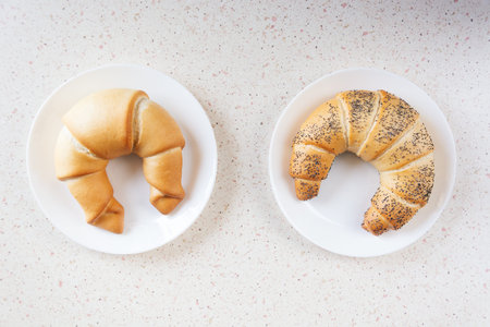 desktop with plates with croissantの写真素材