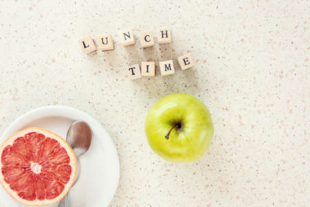 lunch time with apple and red grapefruit home office remote workingの写真素材