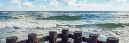 horizontal line of sea waves and wooden balls horizontal, panoramaの写真素材