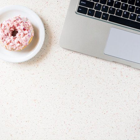 donut on plate laptop and pen on the table remote working square, cube, quadの写真素材