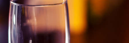 empty shinning glass on blurred background panoramaの写真素材