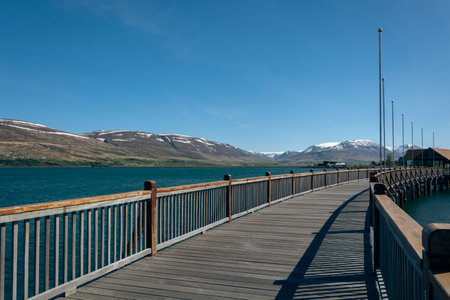 Wooden walkway on the shore of Lake Tekapo, New Zealandの写真素材