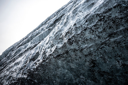 Closeup view of the rock covered with ice. Toned.の写真素材