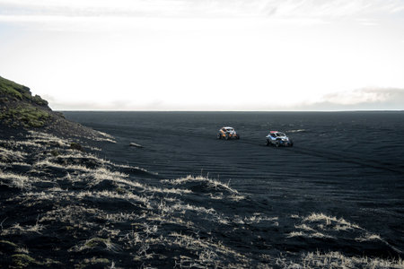 Icelandic landscape with cars on the oceanの写真素材