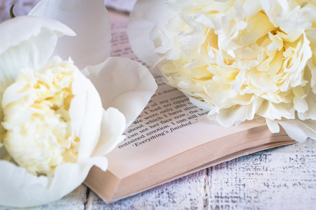 Beautiful white peonies on a white wooden tableの写真素材