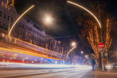 Austria, Vienna-  Night view in the center of Vienna, illuminated. Tram tracks, long exposureのeditorial素材