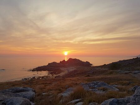 Natural Sunset Sunrise Over Ocean. Scenic Colorful Sky At Sunset. Traveling around the world.の写真素材