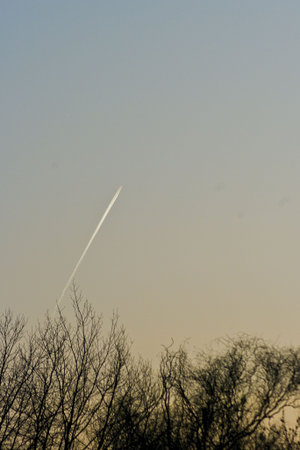 Aircraft flying against the sunset