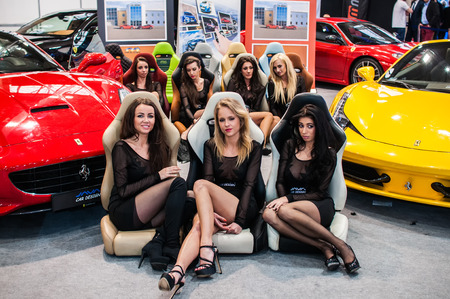 Poznan, Poland. 27th Mar, 2014. Poznan Motor Show is the largest fair event in Poland, the automotive industry, organized every year by the International Fair. On the picture Girls on the stand ferrari.のeditorial素材