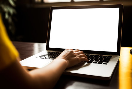 Woman working remotely in front of a laptop in her home office. Close-up of hands and keyboard. Online customer service concept for online stores or help desk. Generative aiの素材