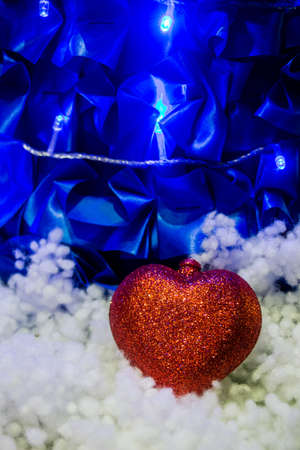Red heart in snow decorationの写真素材