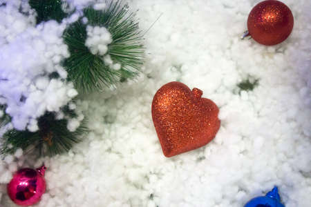 Christmas tree with red heart in snow decorationの写真素材