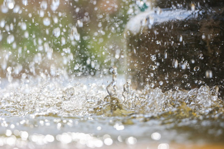 Close up of water drops in the public fountain  - Macro, soft focus