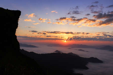 Silhouetted mountain view with morning fog at sunrise time  - Background, Wallpaperの写真素材