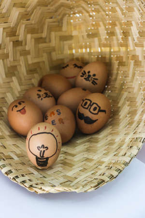 Funny easter eggs, Painted eggs on basketの写真素材