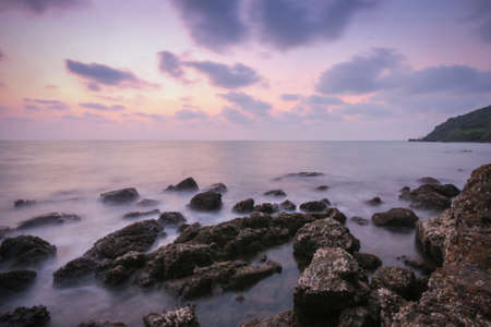 Coastal twilight scene, Long Exposure of rocks and waves at sunset, Landscapte, Backgroundの写真素材