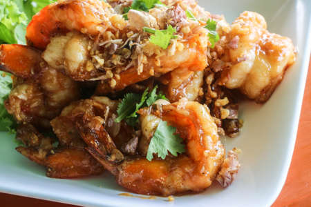 Close up of fried shrimp with chilli sauce and garlic - Thai dishの写真素材