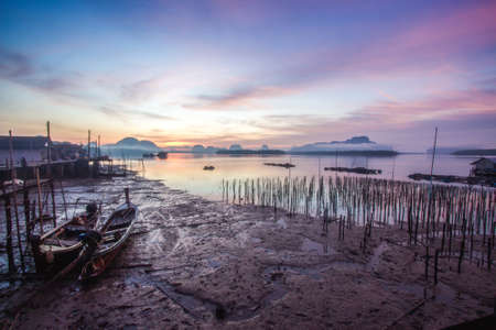 Beautiful sunrise at fisherman village, South of Thailand - Twilight Skyの写真素材