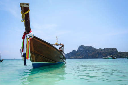 Long tail boat against blue sky and sea. Phi Phi island, Thailandの写真素材