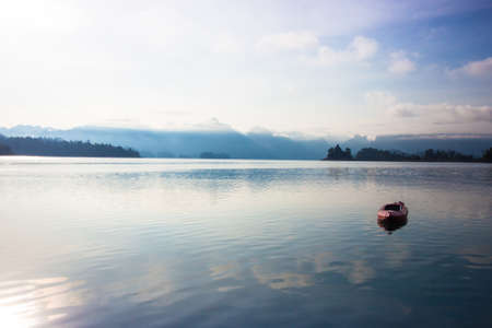 Kayak boat on the lake with blue sky backgroundの写真素材