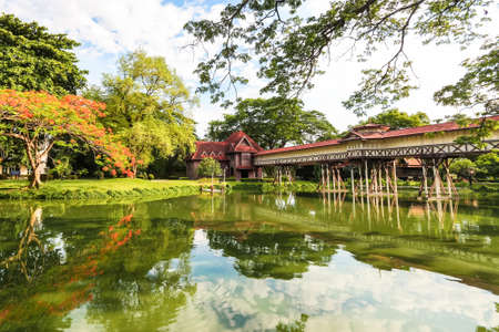 Vintage cross bridge of Sanam Chan Palace against blue skyのeditorial素材