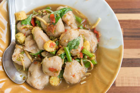 Thai Spicy Food: Spicy stir fried fresh fish balls with basil : in Thai language calledの写真素材