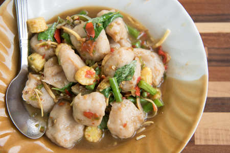 Thai Spicy Food: Spicy stir fried fresh fish balls with basil : in Thai language calledの写真素材