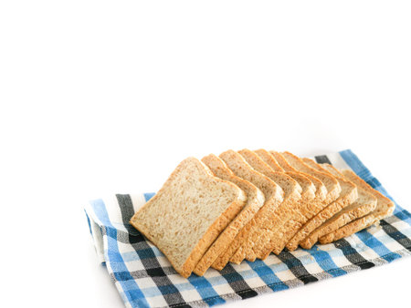 Sliced bread on white background. Sliced homemade bread. Whole grain or whole wheat bread.