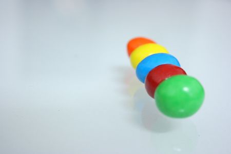 Colourful candy arranged in a line,close upの写真素材