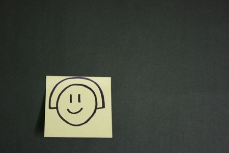 Post it with a smiley drawingの写真素材