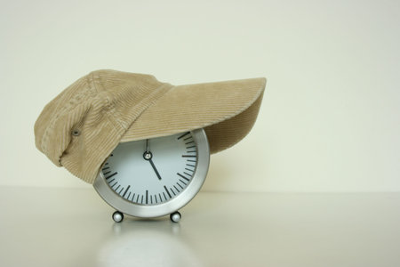 Cap covering a table clockの写真素材
