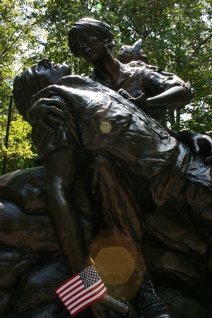 Washington DC,USA, July 22,2010 â Vietnam Veteran's Memorial, Bronze statue of wounded soldier holding the flag of America,low angle.のeditorial素材