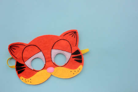 Cat Carnaval mask on blue background. Top view, copy spaceの写真素材