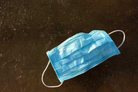 Blue protective mask on frozen river.の写真素材