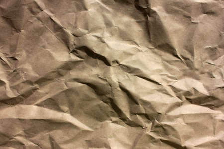 Crumpled kraft paper texture. Abstract rumpled brown paper background.の写真素材