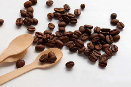 Flat lay composition with coffee beans and wooden spoon. Top view, copy spaceの写真素材