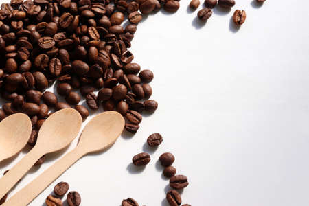 Flat lay composition with coffee beans and wooden spoon. Top view, copy spaceの写真素材