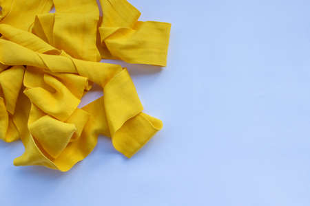 Yellow boxing hand bandage wraps on white background. Sports equipment for boxing. Top view, copy spaceの写真素材