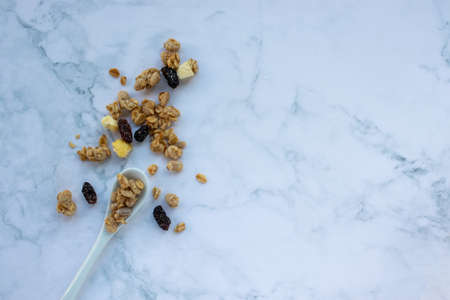 Healthy breakfast with granola and raisinsle backgroundの写真素材