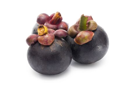 Three ripe mangosteens lined up on white. Clipping path. Full depth.の写真素材