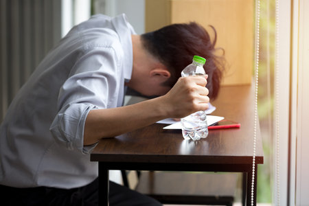 The male employee was fired from work Due to the economic downturn and to the pandemic COVID-19.の写真素材