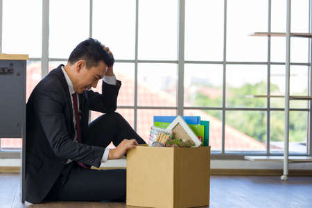 The male employee was stressed because he was fired from work.の写真素材