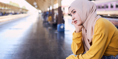 Young Islamic woman is feeling stressed and disappointed.の写真素材