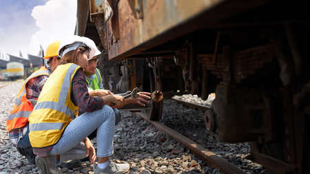 Professional Chief Maintenance Technician is training skills quality maintenance for new workers within factory or warehouse. Mechanical engineering team production in the railway industry.の写真素材