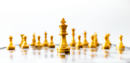 Concept of leadership. Golden king chess on the board on white background. Abstract images show business leadership with copy space.の写真素材