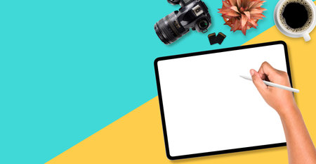 On top of Photographer's working on digital tablet, blank screen with copy space, flat lay.の写真素材