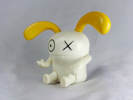 White plasticine character with a sad face on a white background.の写真素材