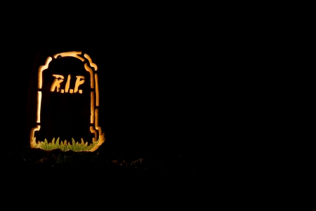 A Halloween tombstone made from a pumpkin の写真素材